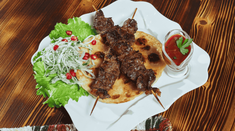 healthy-barbecued-lean-cubed-pork-kebabs-served-with-corn-tortilla-fresh-lettuce-tomato-salad-close-up-view 1 (1) (1)